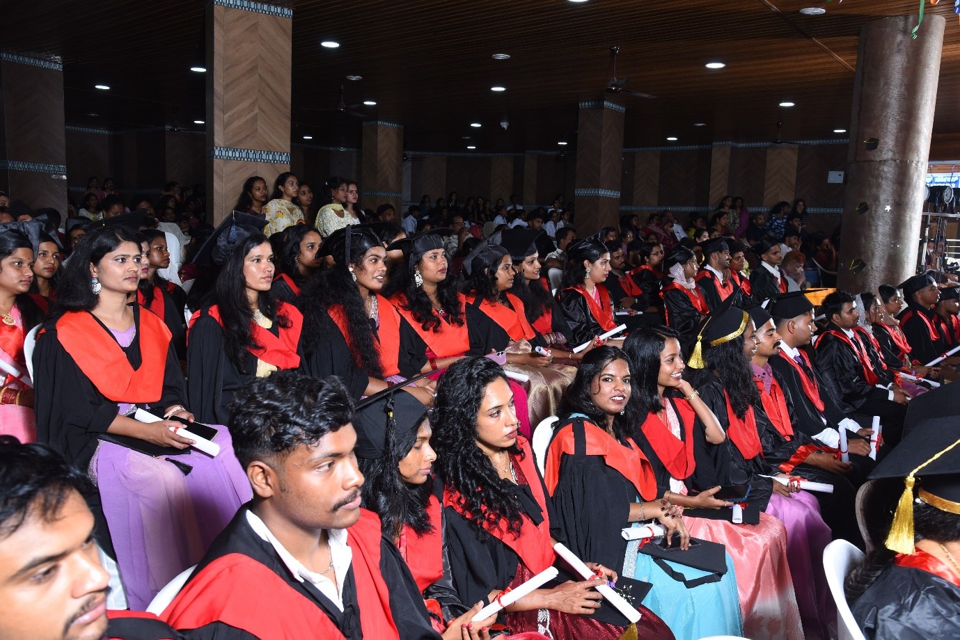 Students attending an academic ceremony in the campus hall