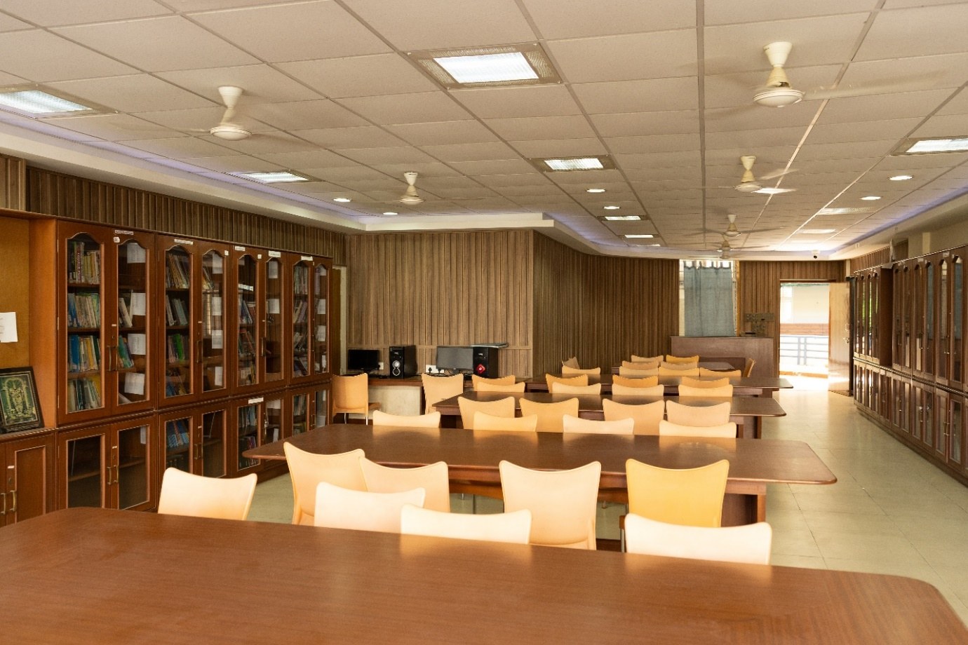 AECS library reading room with book cabinets and study tables