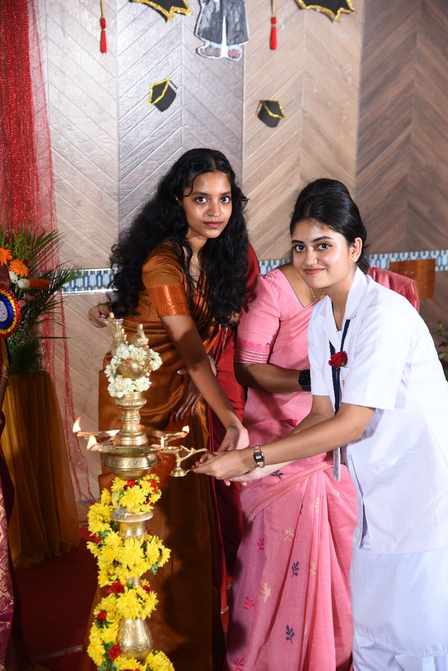 Student and faculty lighting the ceremonial lamp at an AECS event