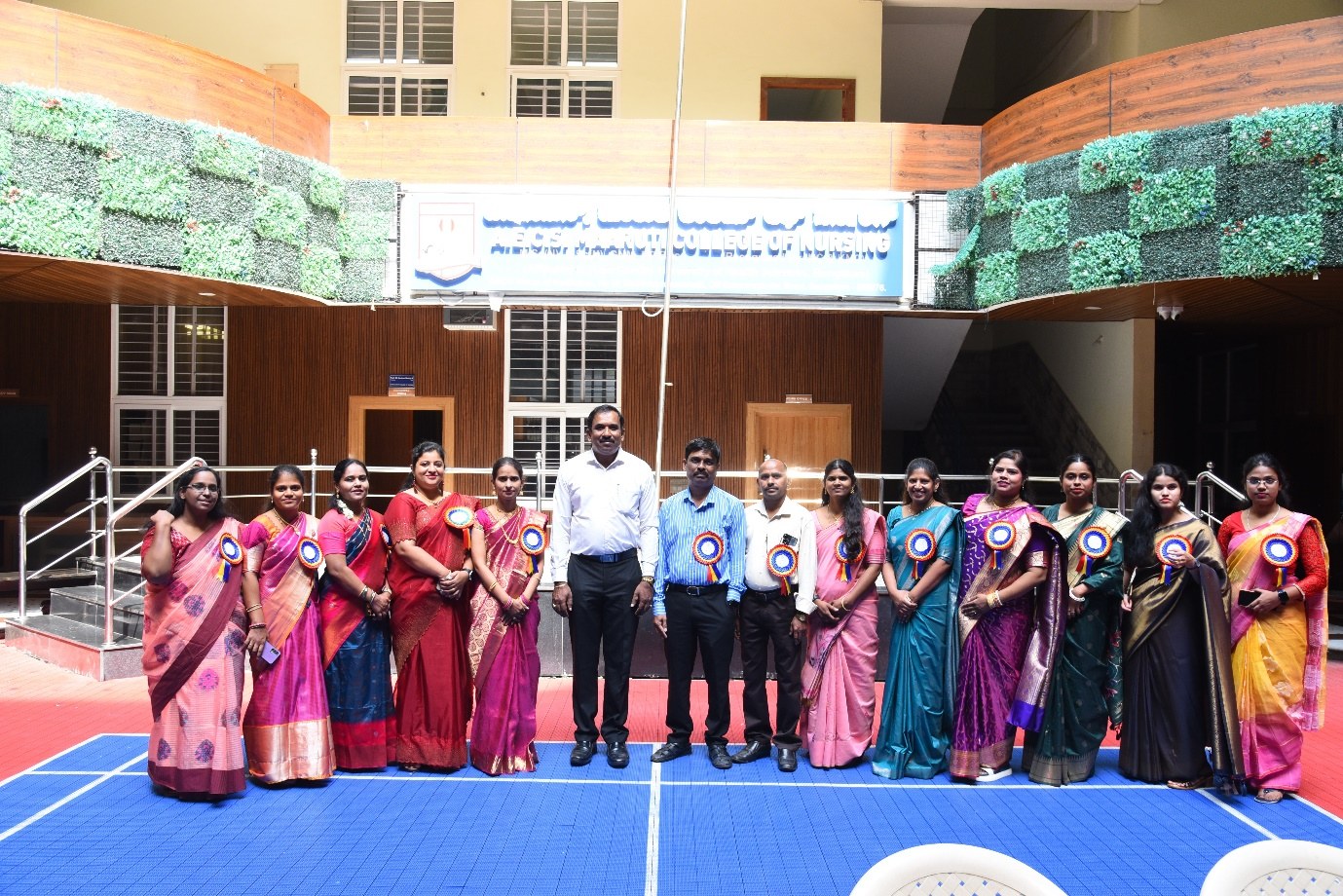 AECS Maaruti College of Nursing faculty and students gathered in the campus atrium