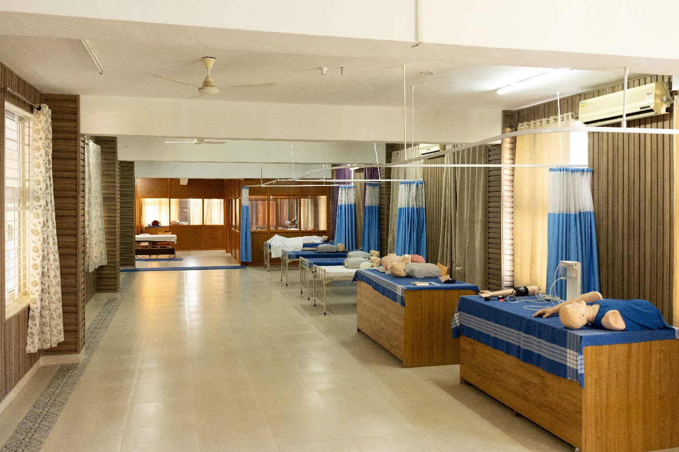 Skill lab hospital beds and patient-care practice mannequins