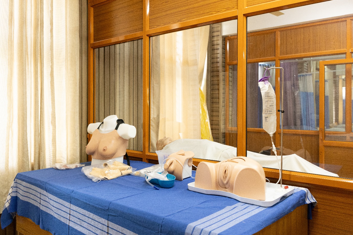Skill lab training area with beds and clinical learning equipment
