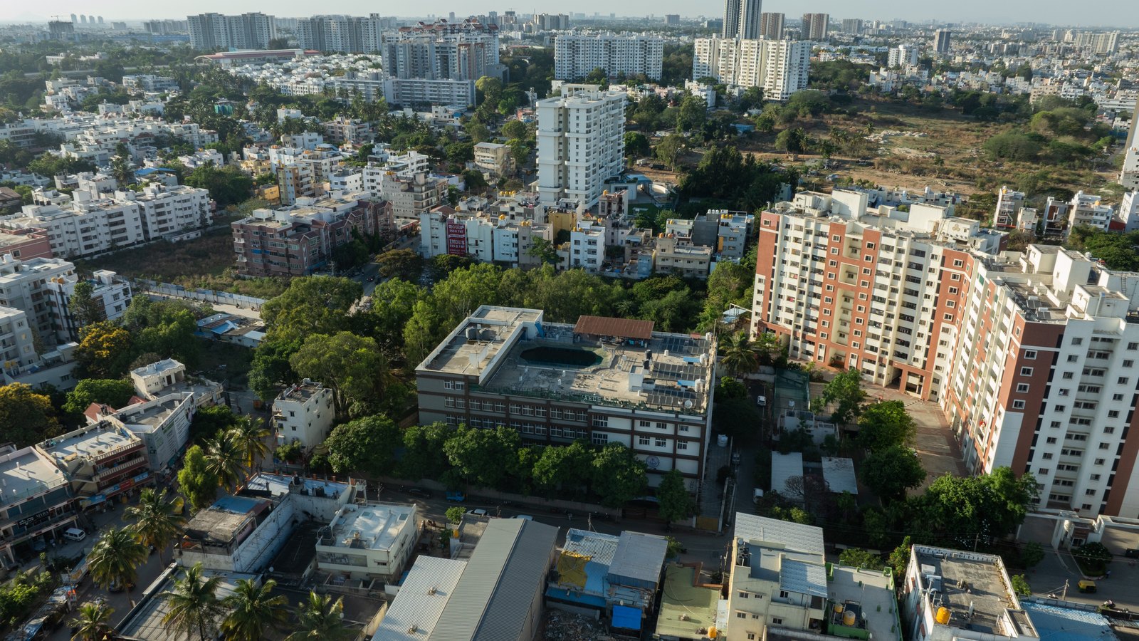 Aerial view showing AECS Maaruti College of Nursing within the Bengaluru cityscape