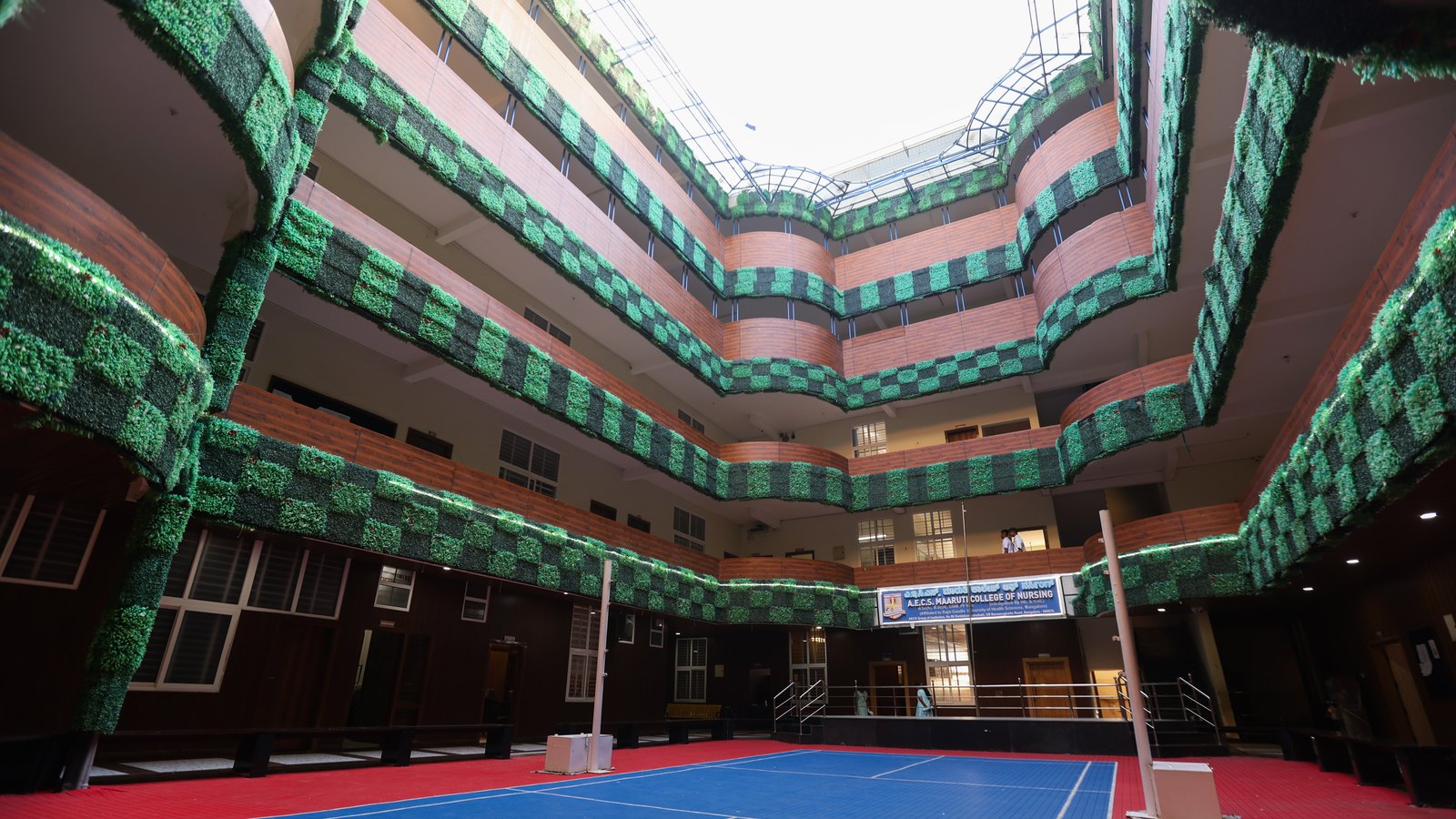 Central student courtyard and indoor court inside the campus building